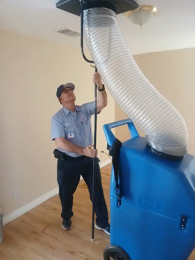 Furnace Tune-Up technician using HEPA equipment in Morton Grove